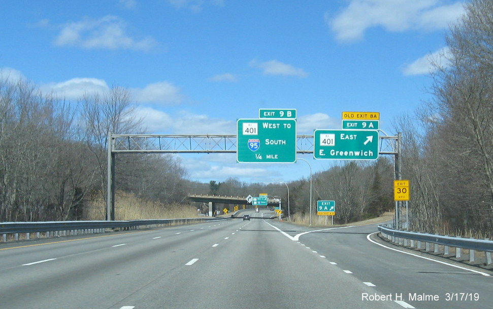 Image of new overhead signs with new exit numbers and old exit number tab at RI 403 East ramp from RI 4 North in East Greenwich