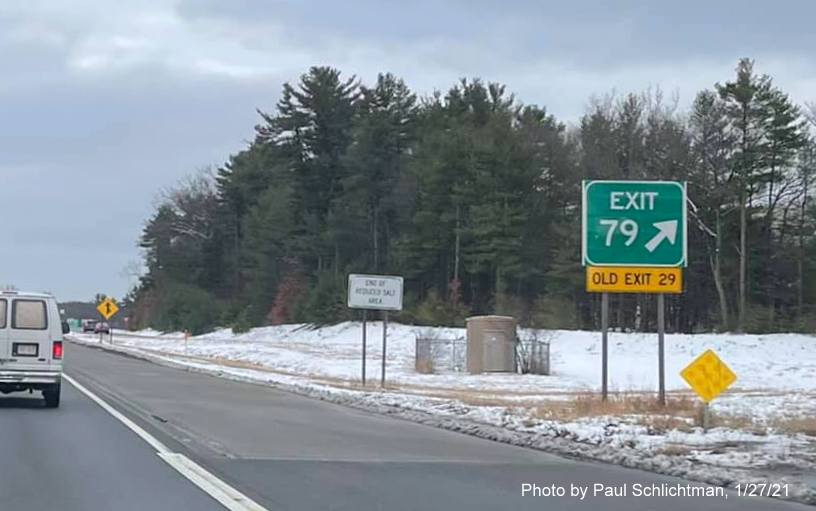 Image of gore sign for MA 129 exit with new milepost based exit number and yellow old exit number sign below on US 3 South in Chelmsford, by Paul Schlichtman, January 2021