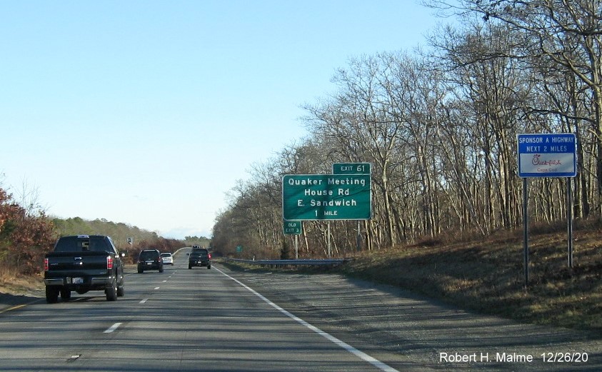 Image of 1-mile advance sign for Quaker Meeting House Road exit with new milepost based exit number and green old exit number sign on left support post on US 6 East in Sandwich, December 2020