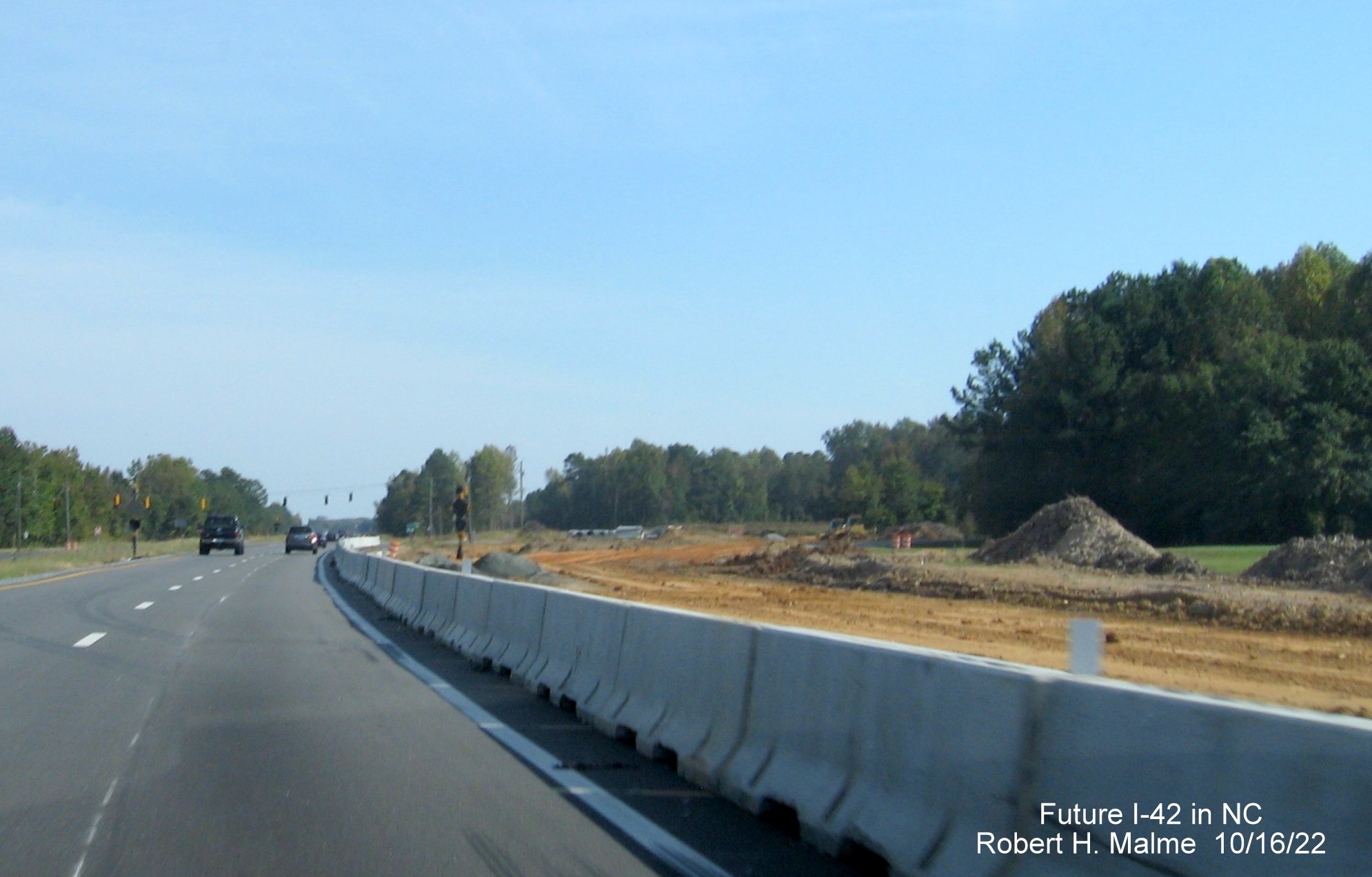 Image of graded new lanes for Future I-42 interchange with Strickland Road on US 70 East in Wilson Mills, October 2022