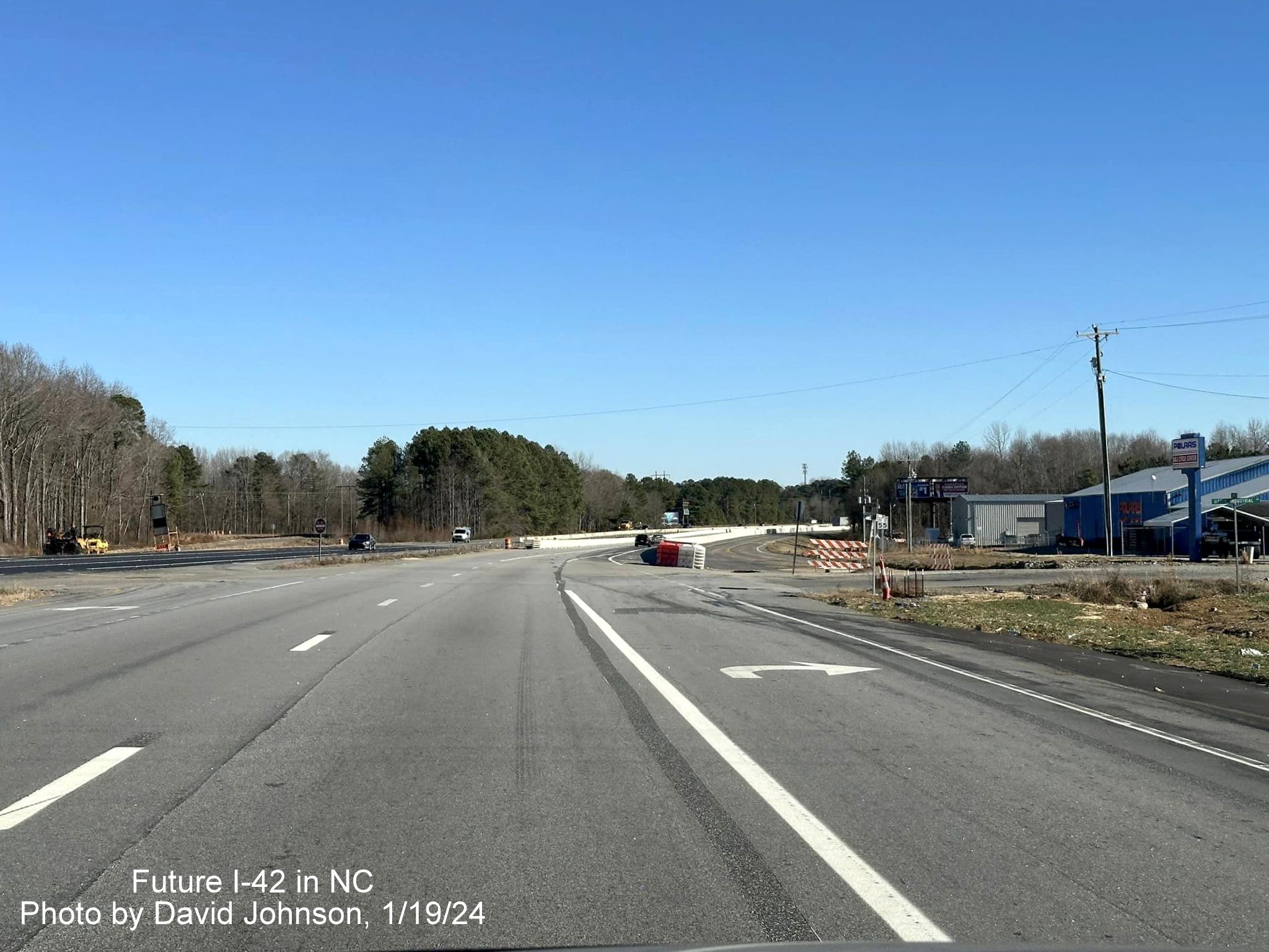 Image of traffic on US 70 (Future I-42) at still open Uzzie Industrial Drive in Johnston County work zone, photo by David Johnson, January 2024