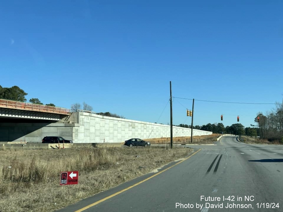 Image of US 70 East roadway at current intersection with future Wilson's Mills Road interchange in Johnston 
       County work zone, photo by David Johnson, January 2024