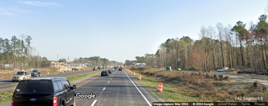 Image of frontage road construction along US 70 (Future I-42) East near Thurman Road in James City in 
       improvement project construction zone, Google Maps Street View, March 2024