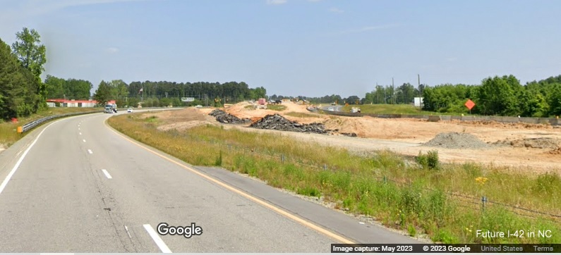 Image of US 70 to the west of Wilson's Mills Road showing construction of Future I-42 roadway, 
      Google Maps  Street View, May 2023