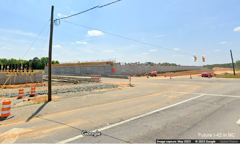 Image of constructing future I-42 bridge over Wilson's Mills Road from US 70 West, Google Maps  Street View, May 2023