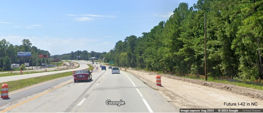 Image of future US 70 East lanes merging into current lanes beyond western end of Havelock Bypass (Future I-42), Google Maps Street View, August 2023