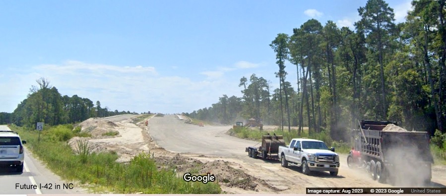 Image of future US 70 East lanes heading for bridge over the Havelock Bypass (Future I-42), Google Maps Street View, August 2023