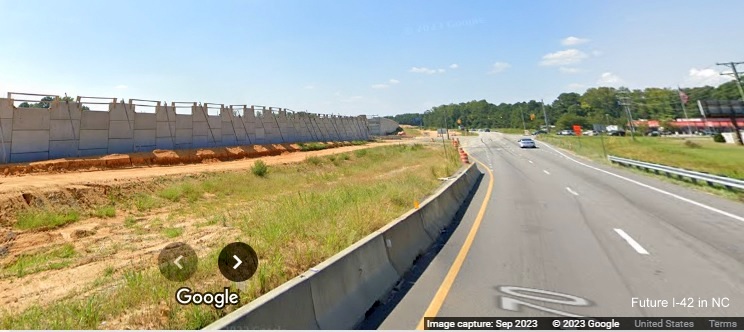 Image of approaching Wilson's Mills Road intersection with I-42 bridge work along US 70 West in Johnston County, Google Maps Street View, September 2023