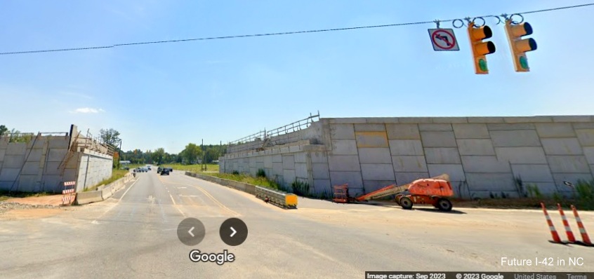 Image of Wilson's Mills Road passing through future bridge abutments in work zone along US 70 (Future I-42) West in Johnston County, Google Maps Street View, September 2023