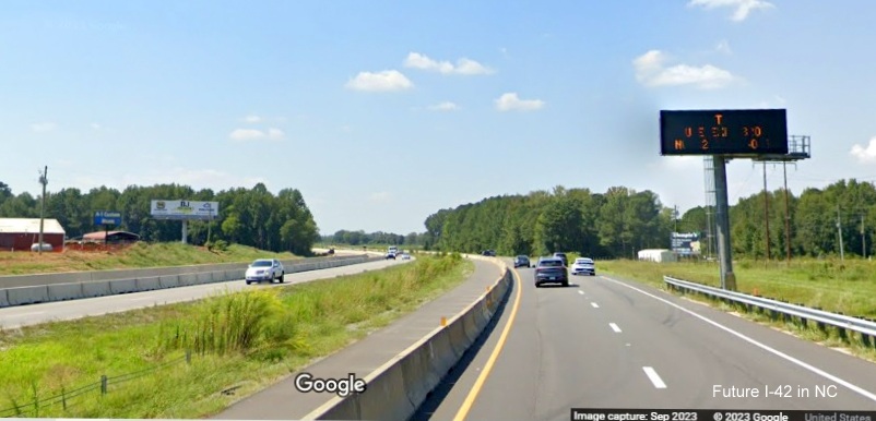 Image of permanent VMS sign along US 70 (Future I-42) West after the Strickland Road intersection
      in Johnston County, Google Maps Street View, September 2023