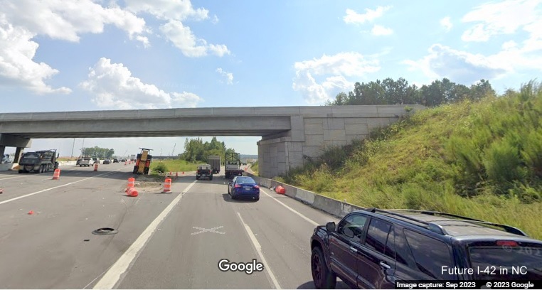Image of US 70 (Future I-42) East exit ramp from I-40 East in Garner heading under new bridge built
     as part of NC 540 construction project, Google Maps Street View, September 2023