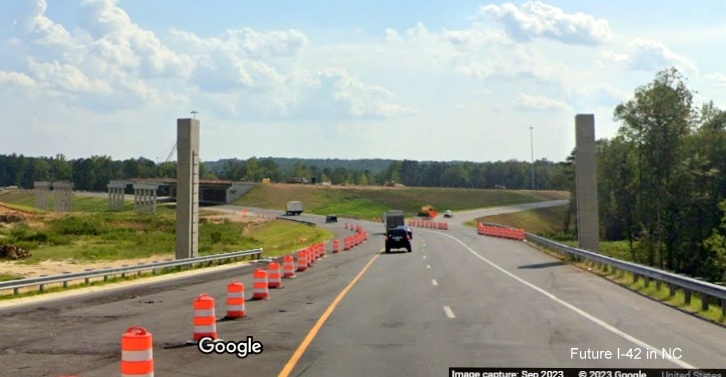 Image of overhead ramp sign posts for future split of ramps for US 70 (Future I-42) East and NC 540 West/Triangle Expressway in Garner, Google Maps Street View, September 2023