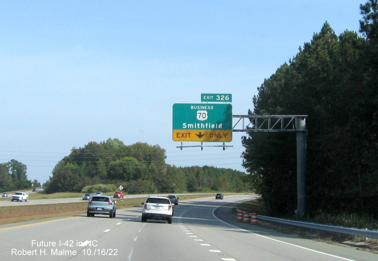 Image of overhead ramp sign for Business 70 exit on US 70 (Future I-42) East Clayton Bypass, October 2022