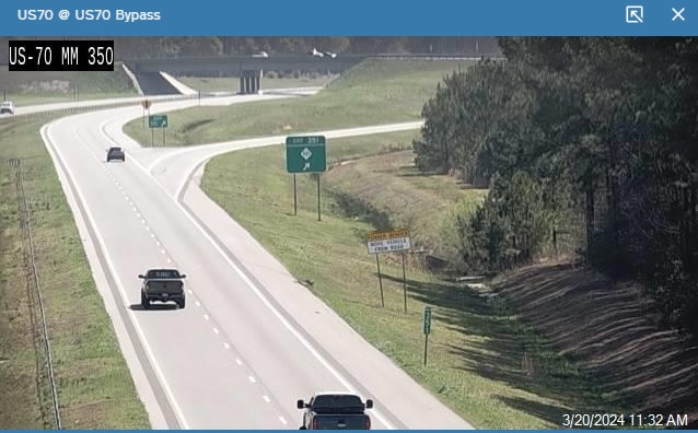 Image of ground mounted exit sign with US 70 milepost number on Goldsboro Bypass, NCDOT March 2024