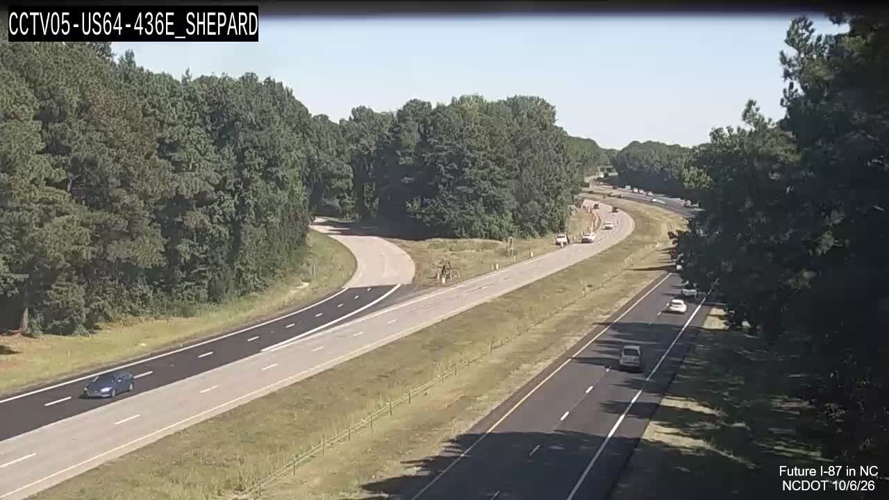 Image from NCDOT traffic camera of two lanes of new paving as part of pavement
rehabilitation project along West US 64/264 near mile marker 436, October 2026