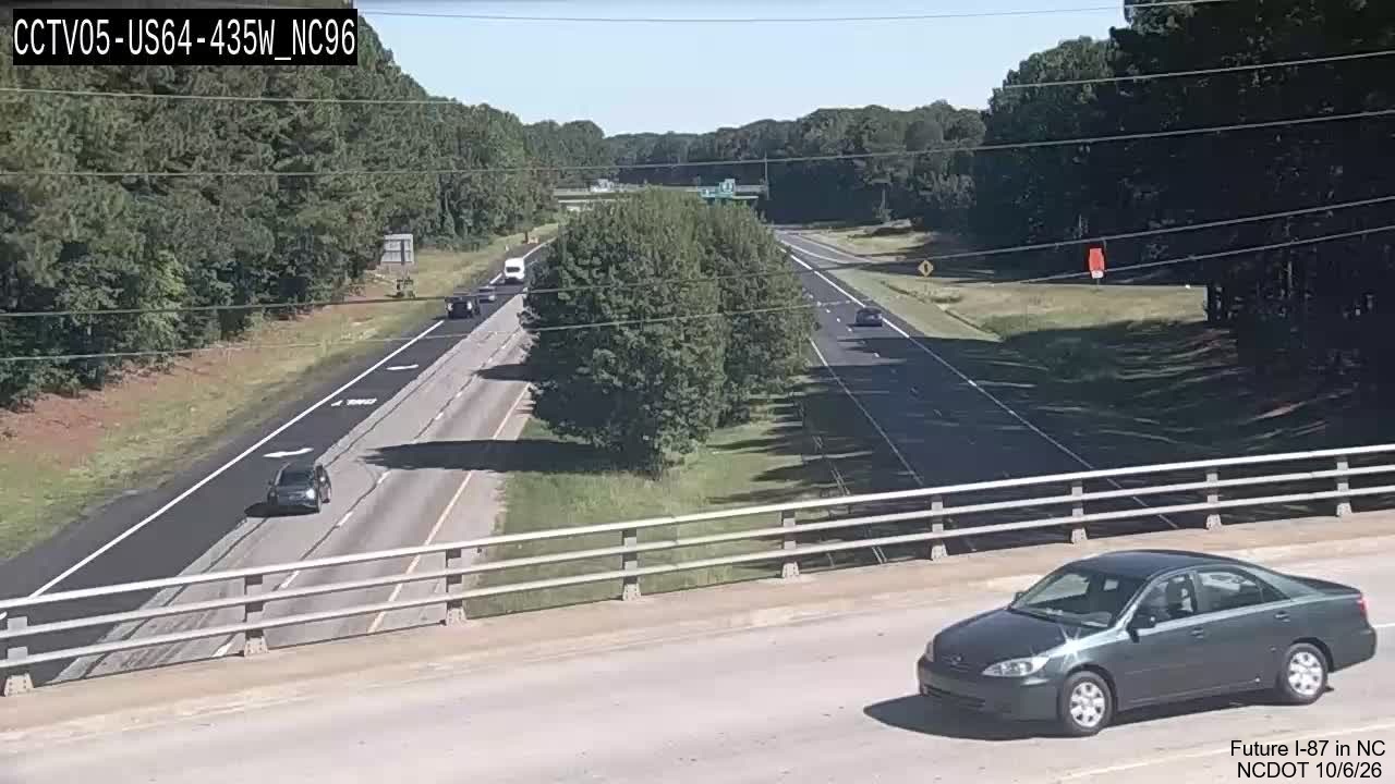 Image from NCDOT traffic camera of two lanes of new paving as part of pavement
rehabilitation project along West US 64/264 near mile marker 436, October 2026