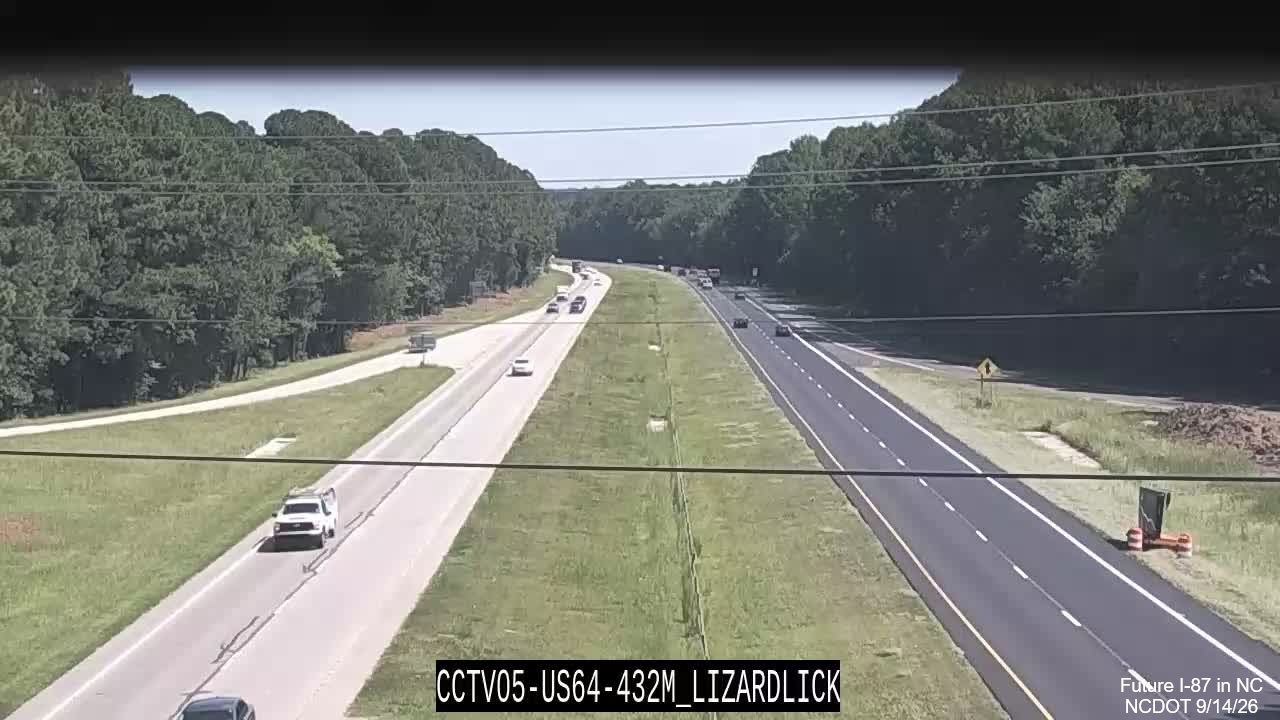 Image from NCDOT traffic camera of two lane paving as part of pavement
rehabilitation project along East US 64/264 near mile marker 432, September 2026