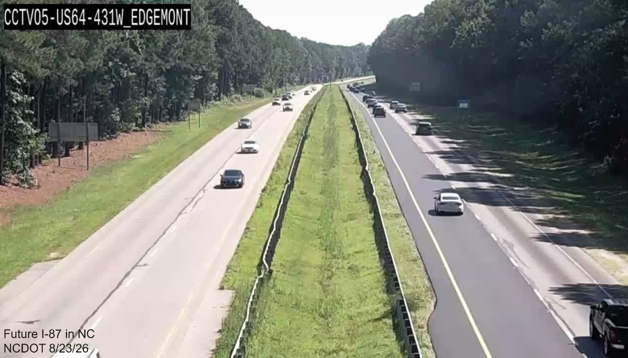 Image from NCDOT traffic camera of initial paving as part of pavement rehabilitation
project along East US 64/264 near mile marker 431, August 2026