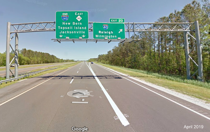 Google Maps Street View image of altered overhead signage at end of I-140 East at I-40 in Wilmington, taken in April 2019