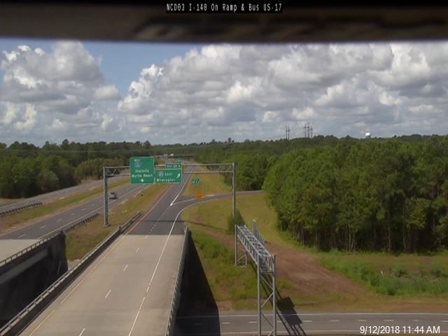 NCDOT traffic camera image from Oct. 2018 showing US 17 shield removed from I-140 overhead pull through sign at I-40 exit