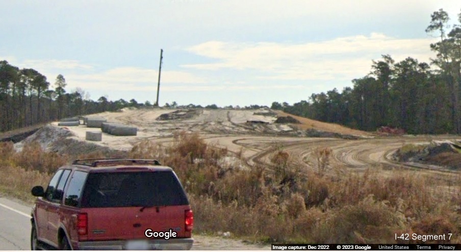 Image of future US 70 East lanes being built over future end of I-42 Havelock Bypass, Google Maps Street View, December 2022
