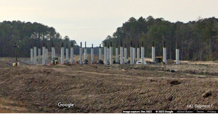 Image of future bridge supports as part of I-42 Havelock Bypass seen from US 70 East in New Bern, Google Maps Street View, December 2022