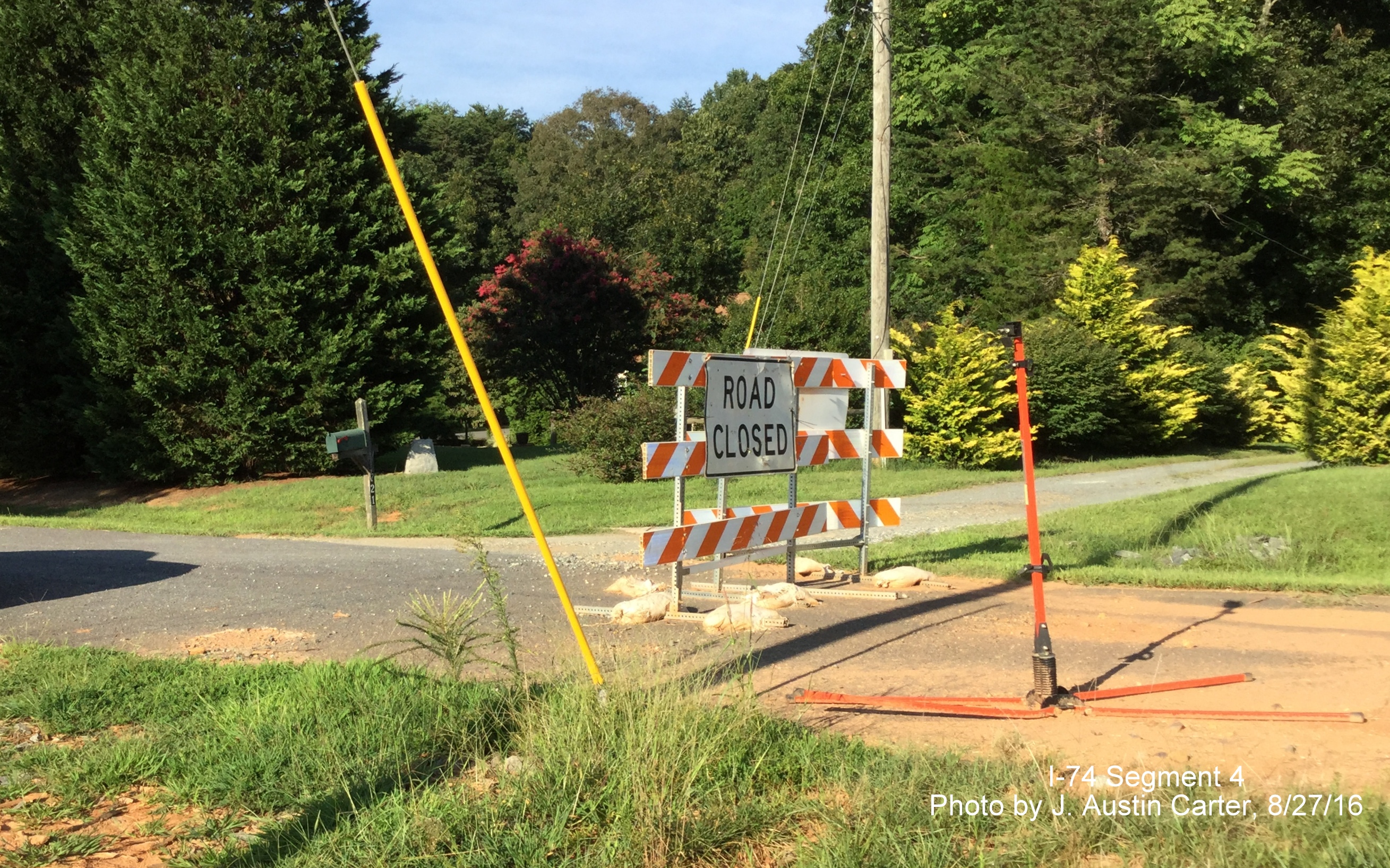 Image of road closed barrier placed on residential street due to construction of Winston-Salem Northern Beltway, by J. Austin Carter
