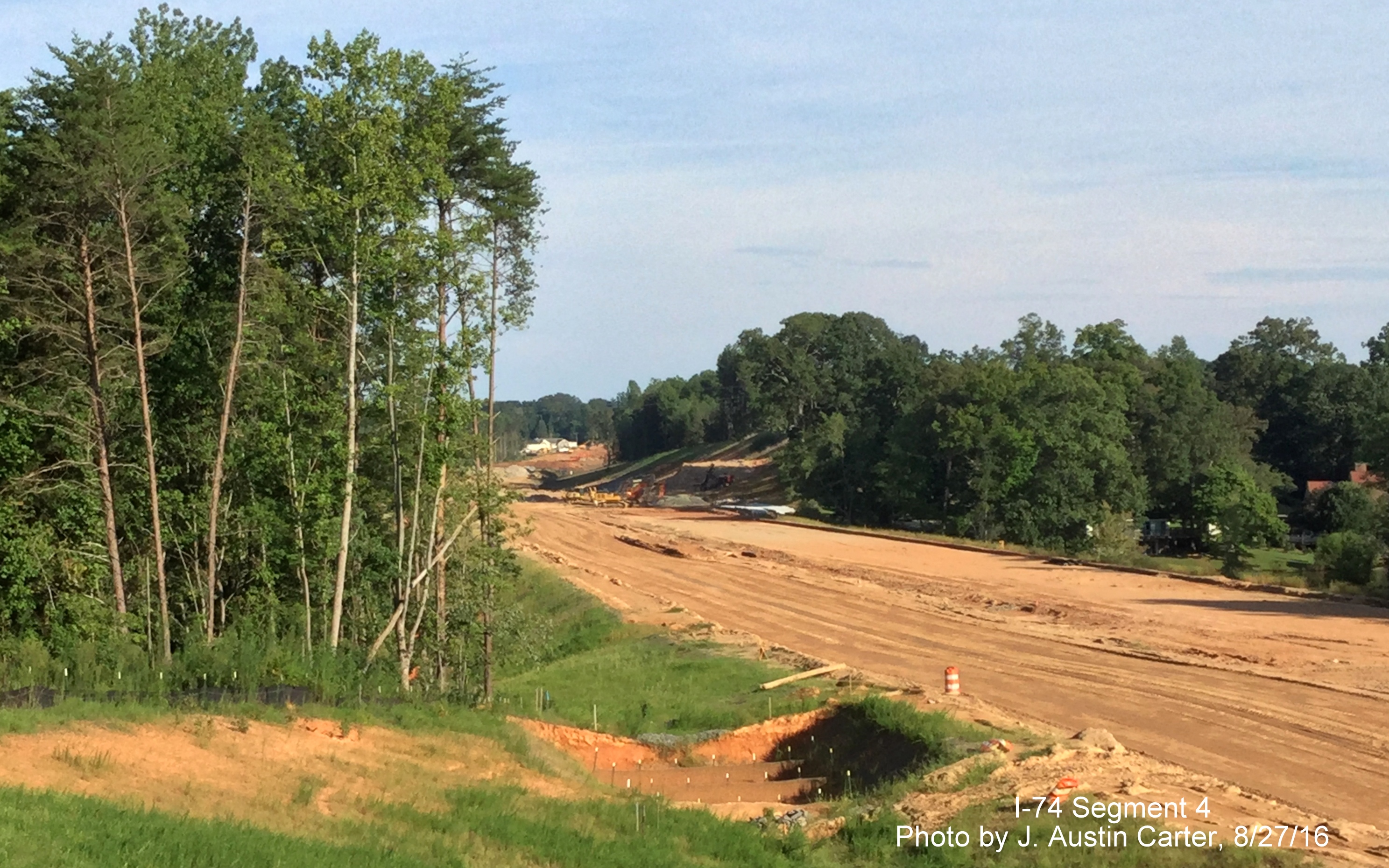 Image of Beltway construction going on between houses east of Winston-Salem, by J. Austin Carter