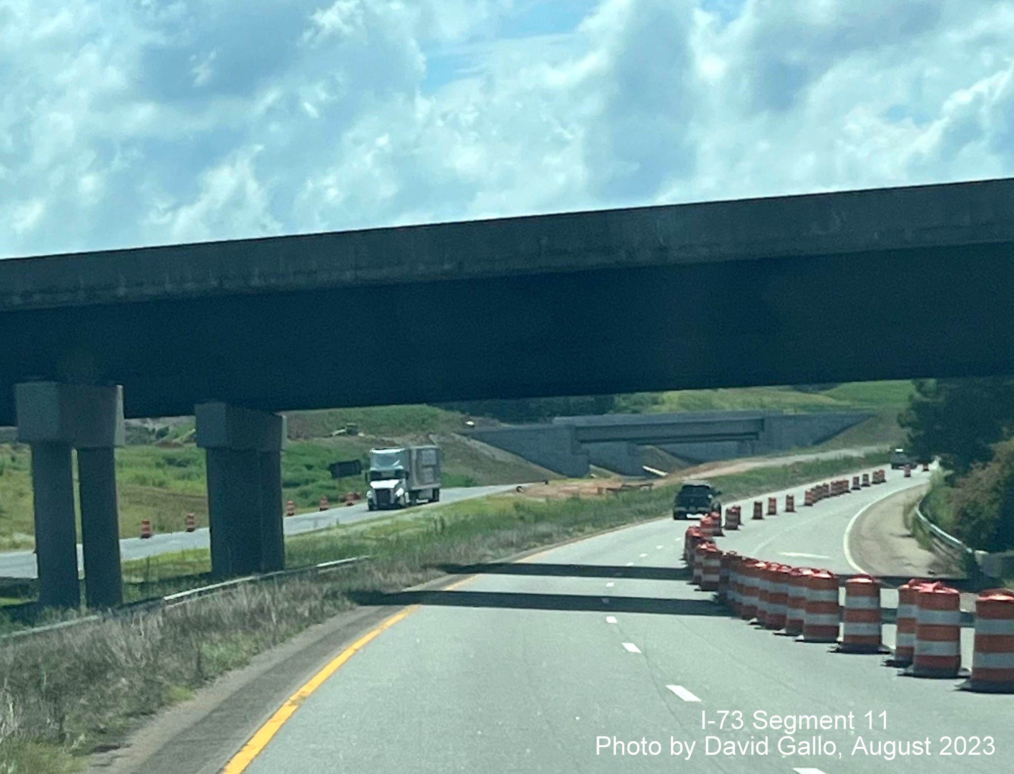 Image of lane closure after US 74 Business East ramp brudge over US 74 East in Rockingham Bypass 
        construction zone, David Gallo, July 2023