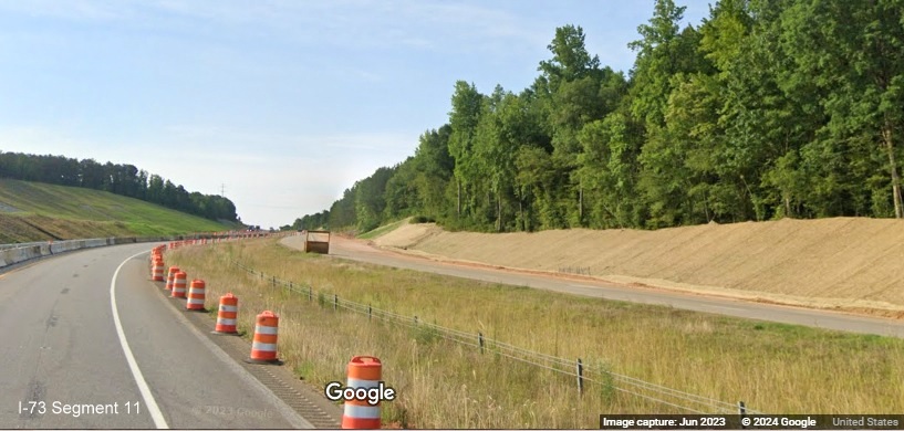 Image of future I-74 East lanes from temporary US 74 East lanes in I-73/I-74 Rockingham Bypass construction
        zone, Google Maps Street View, June 2023