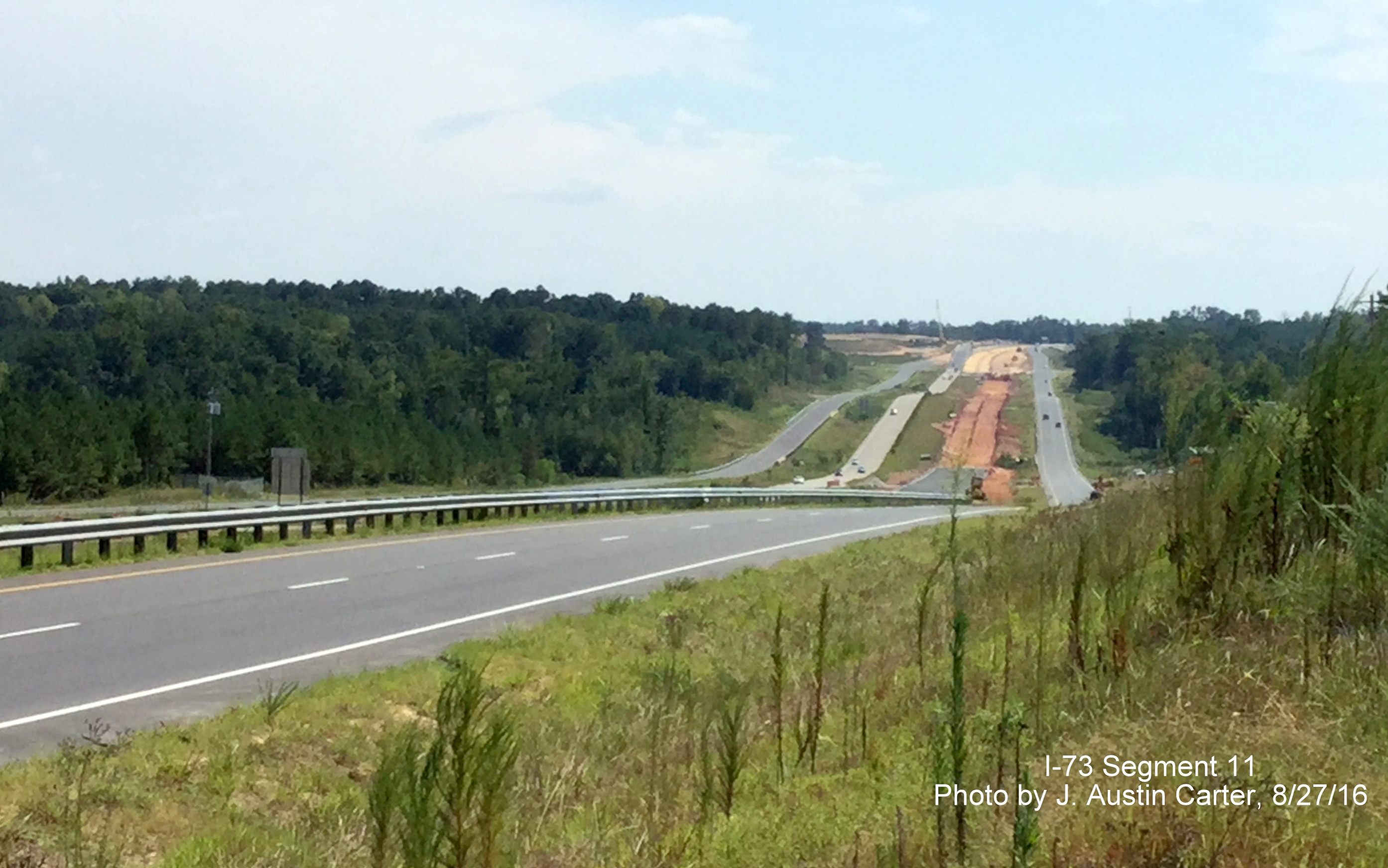 Image of US 220 looking south showing progress in building frontage roads along future I-73/74, from J. Austin Carter