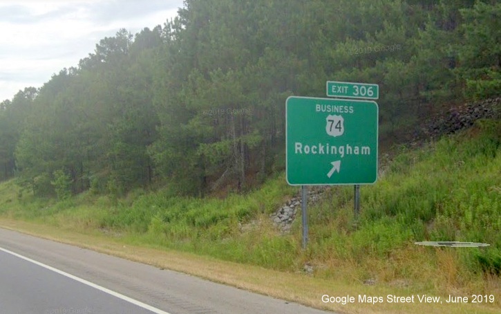Google Street view image of ground mounted exit sign for Business 74 West 
	  exit on US 74/Future I-74 West, I-73 North in Rockingham, taken in June 2019