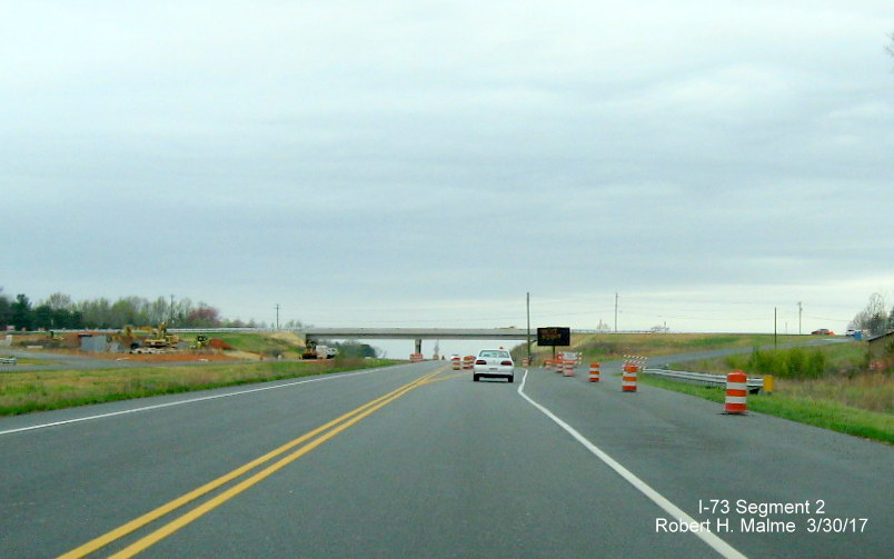 Image of view northbound on US 220 looking at approaching NC 65 bridge, almost completed