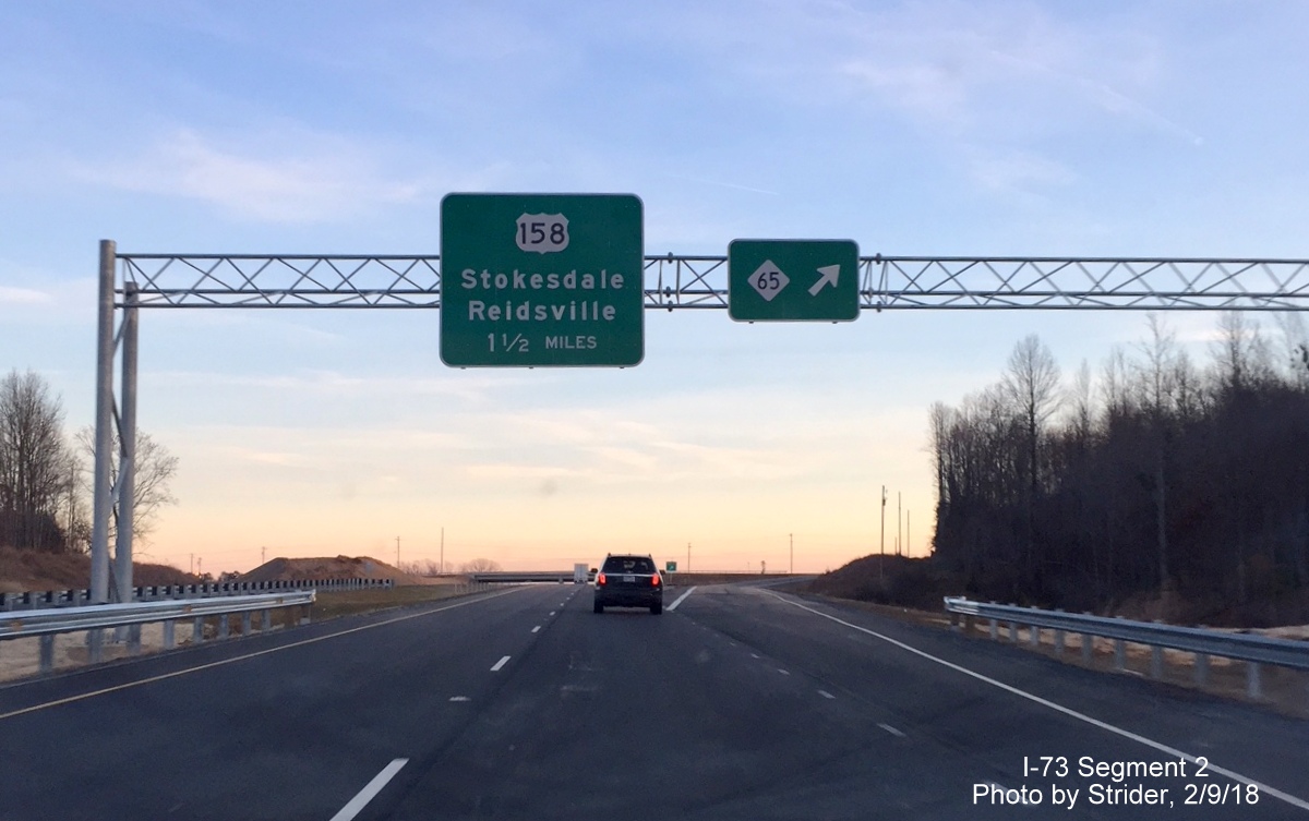 Image of new overhead signs for NC 65 and US 158 exits on US 220/Future I-73 South near Stokesdale, by Strider