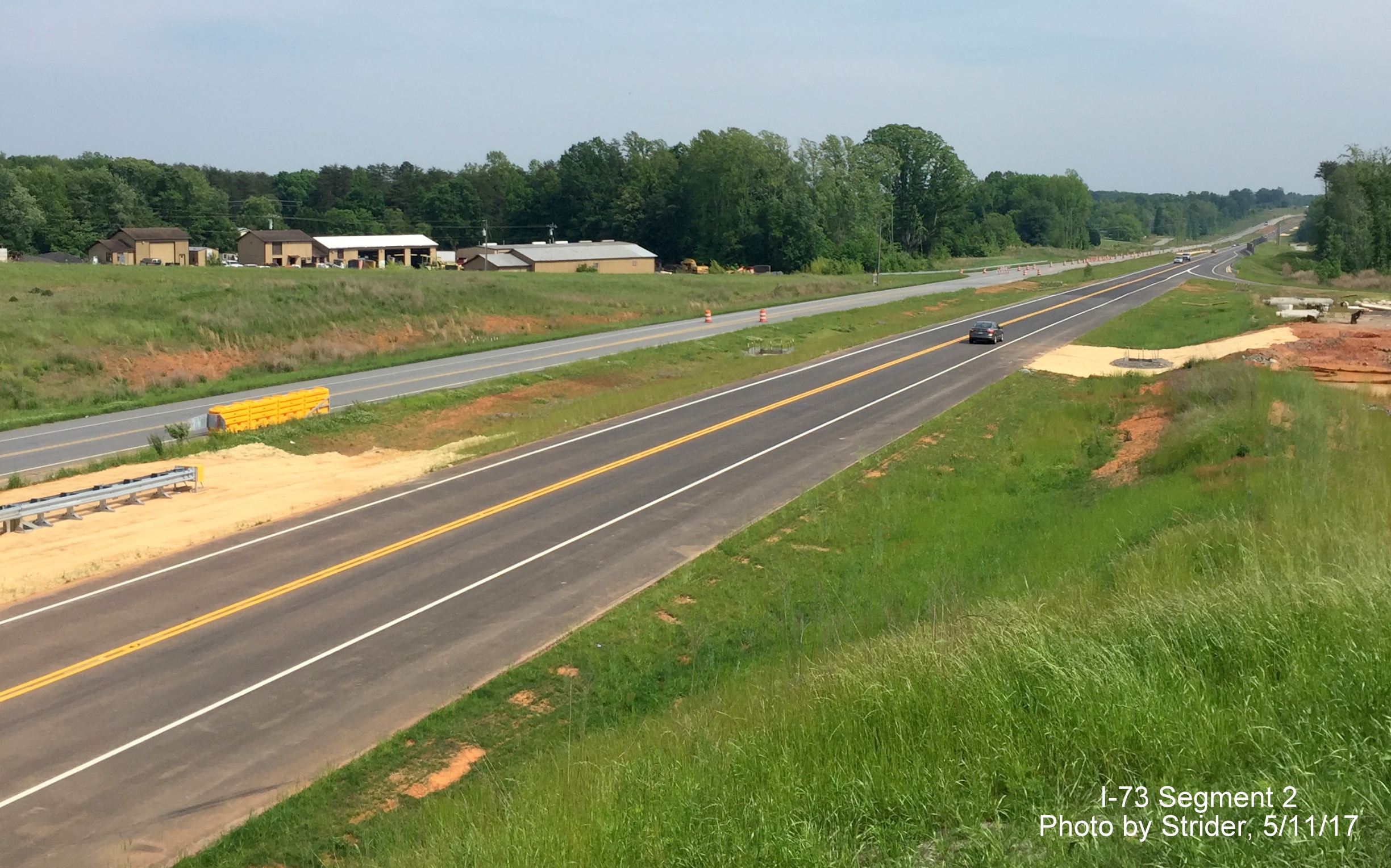 Image of US 220 traffic using Future I-73 South lanes from NC 65 bridge, by Strider