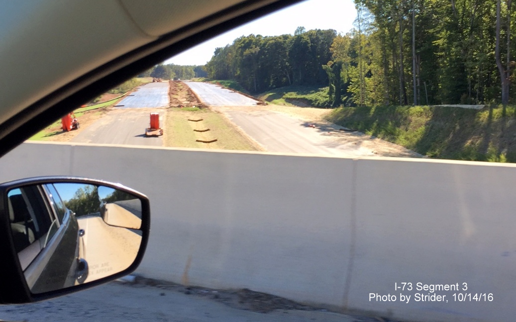 Image looking south from US 220 South overpass showing paving for future I-73 roadway, from Strider