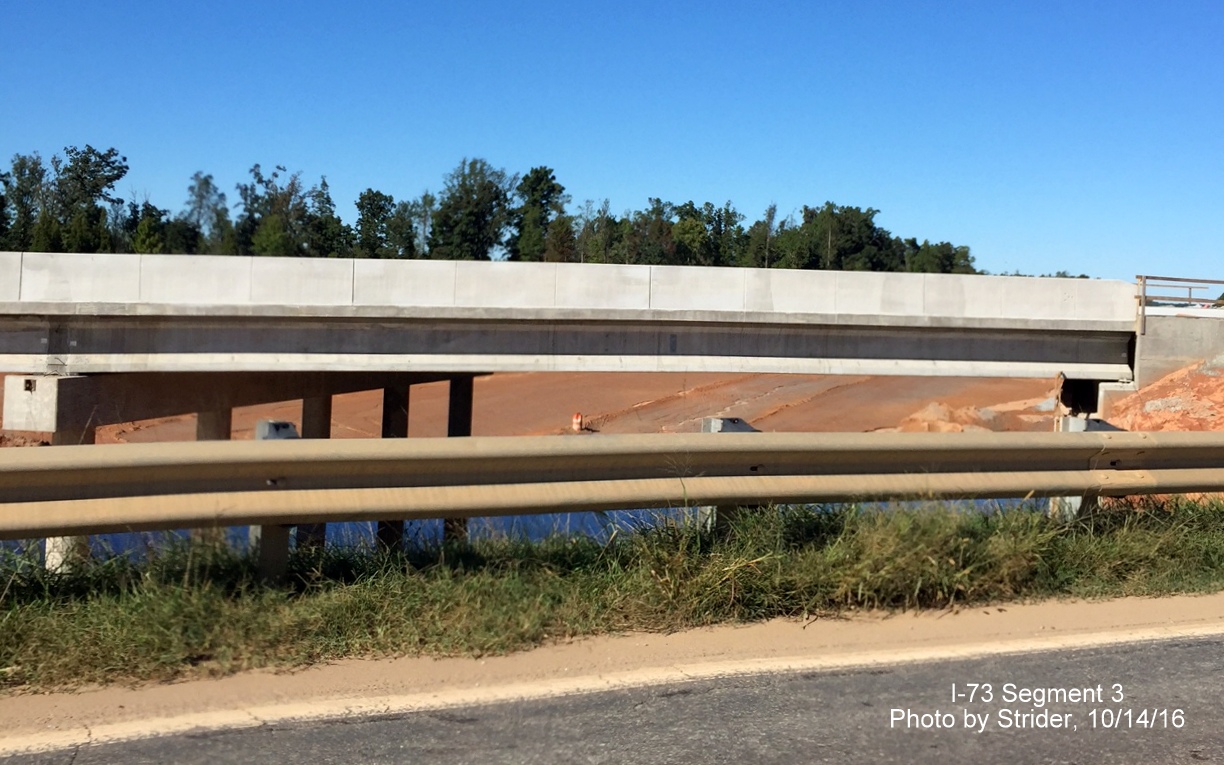 Image showing completed NC 150 bridge over future I-73 roadway near Summerfield, from Strider