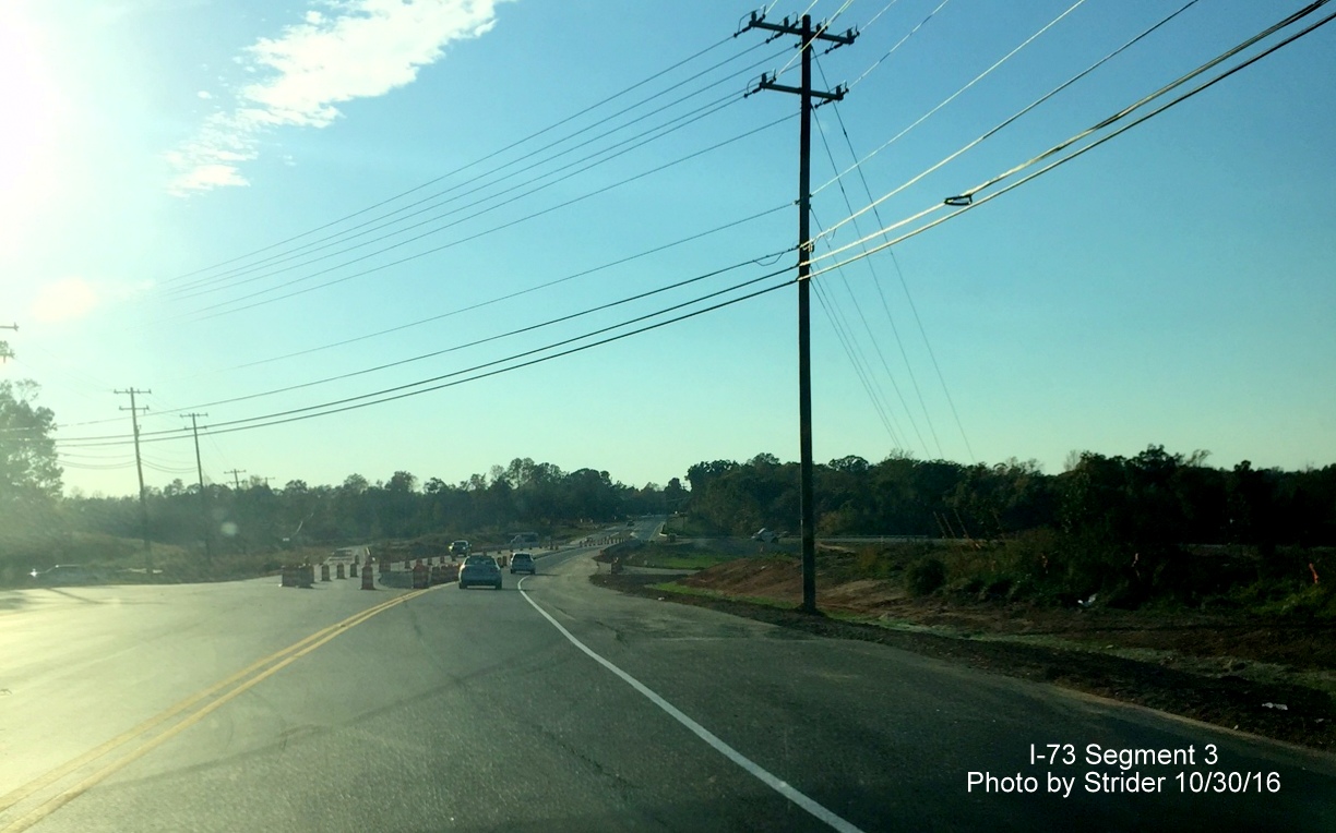 Image of view on NC 150 west approaching the I-73 interchange showing traffic crossing the now opened bridge, from Strider
