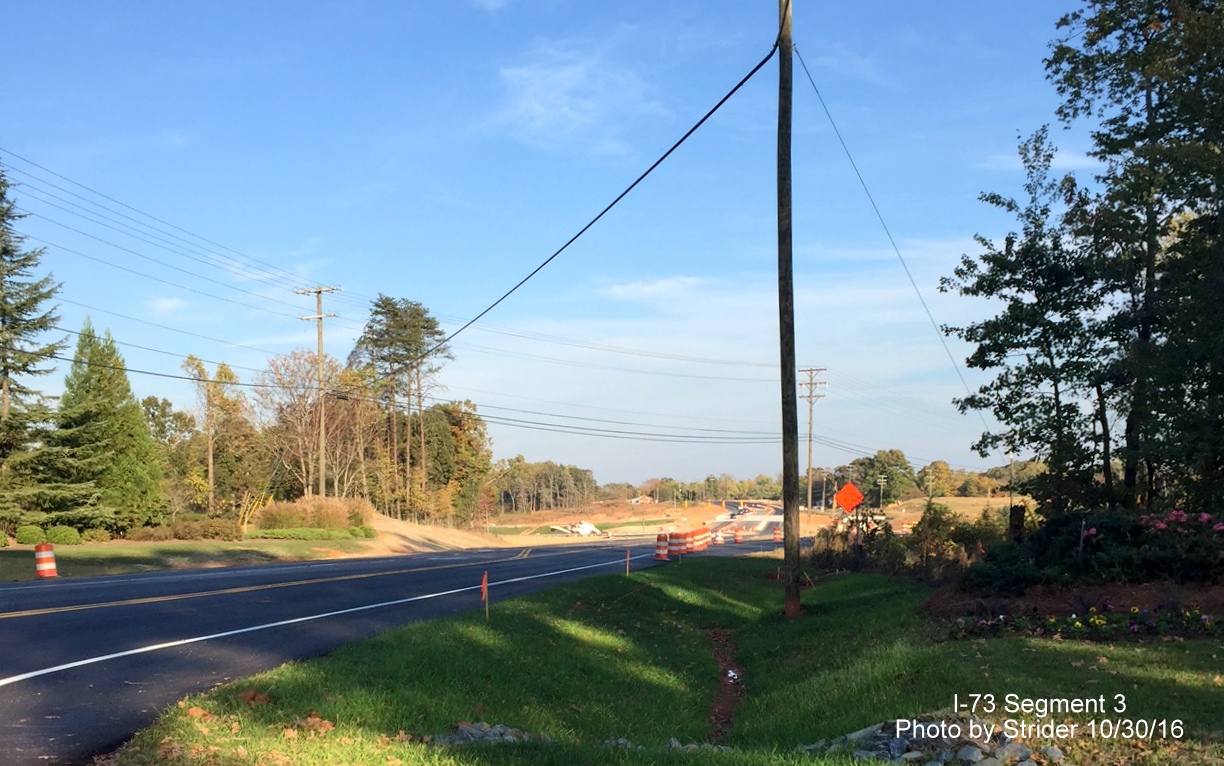 Image of view along NC 150 East showing traffic using new bridge over future I-73, from Strider