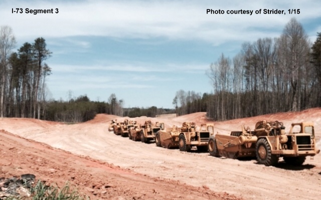 Looking north of Alcorn Road and clearing for the future I-73 roadbed along with 
several construction vehicles idle for the moment.