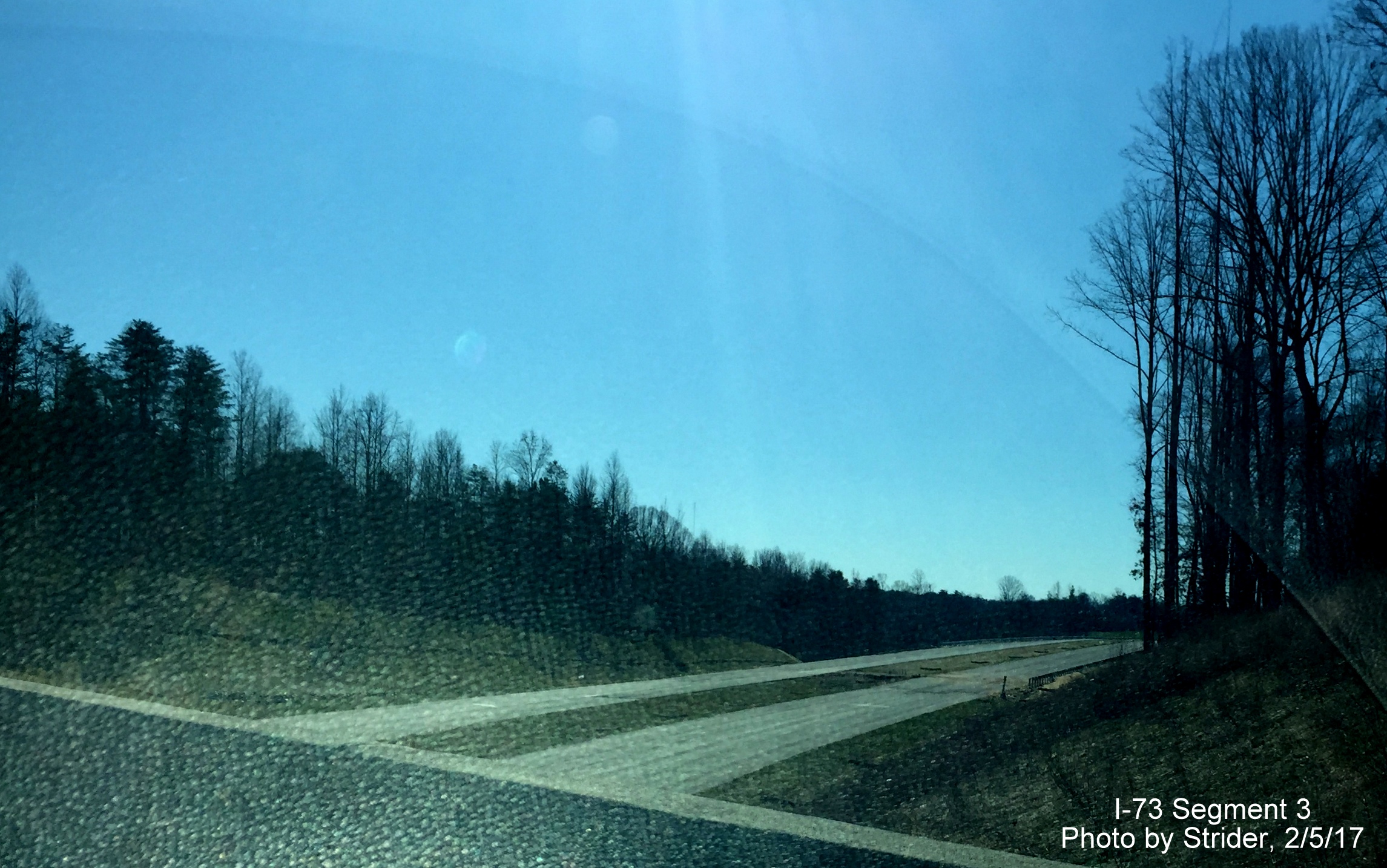 Image of view looking south from US 220 South bridge overlooking northern segment of future I-73 roadway, by Strider
