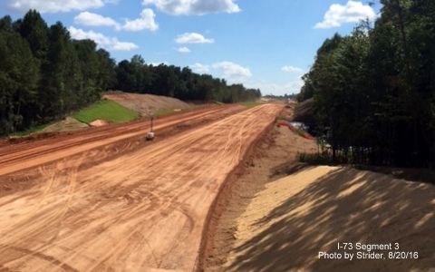 Image looking south from Deboe Rd bridge showing grading progress for I-73 freeway, from Strider