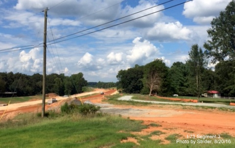 Image from Deboe Road looking at US 220 interchange bridge with future I-73 in distance, from Strider