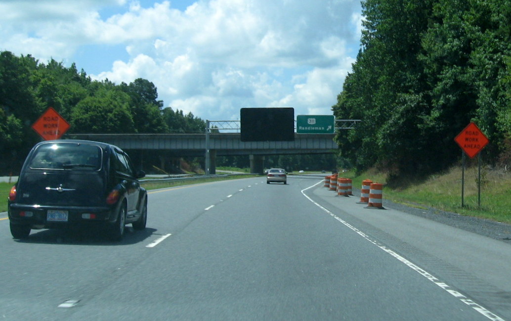 Photo of New exit signage put up for the US 311 exit on southbound US 220 
(Future I-73) in July 2012