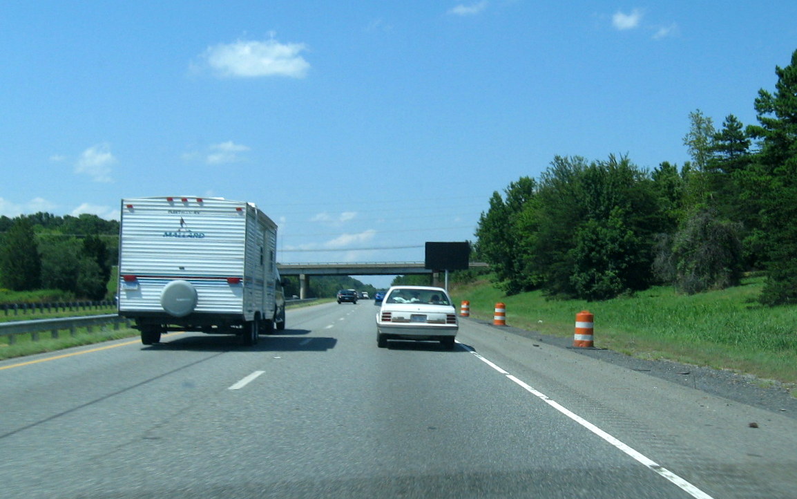 Photo of newly installed exit sign for future I-74 freeway interchange with 
US 220 (I-73) North, July 2012