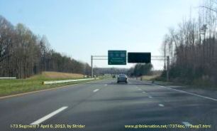 Photo of covered exit sign for future I-74 freeway interchange with 
US 220 (I-73) South, from Strider, Apr 2013