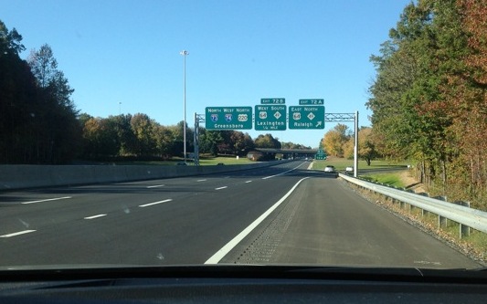 Photo of new I-73/I-74 overhead signage on US 64/NC 49 in Asheboro, courtesy 
of JC Austin