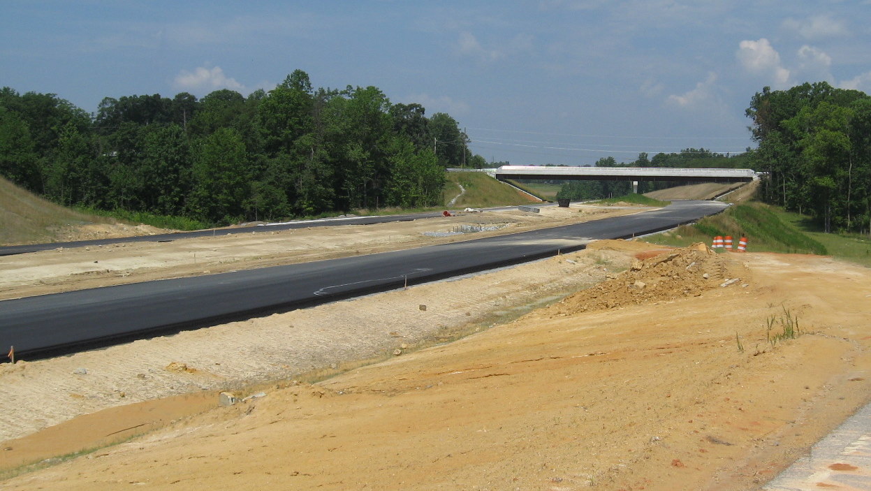 View of I-74 freeway showing progress on laying pavement for the future 
roadway, June 2010