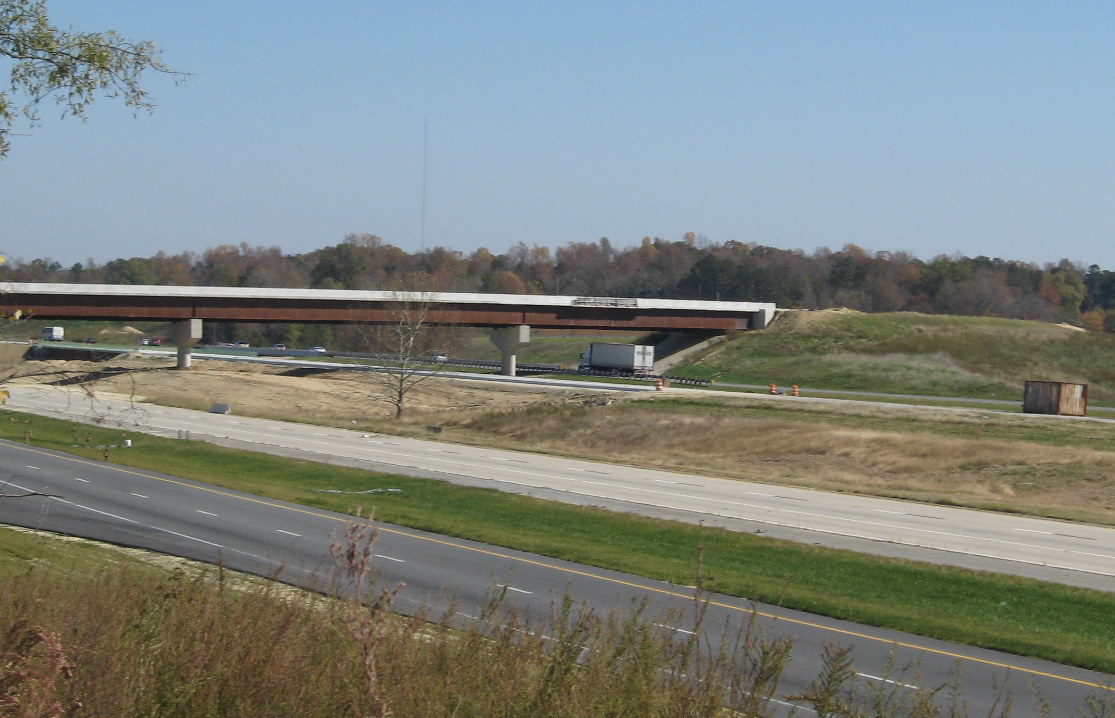 Photo of I-85/I-74 interchange under construction in Nov. 2009 showing the 
need for more walls and asphalt for the roadbed