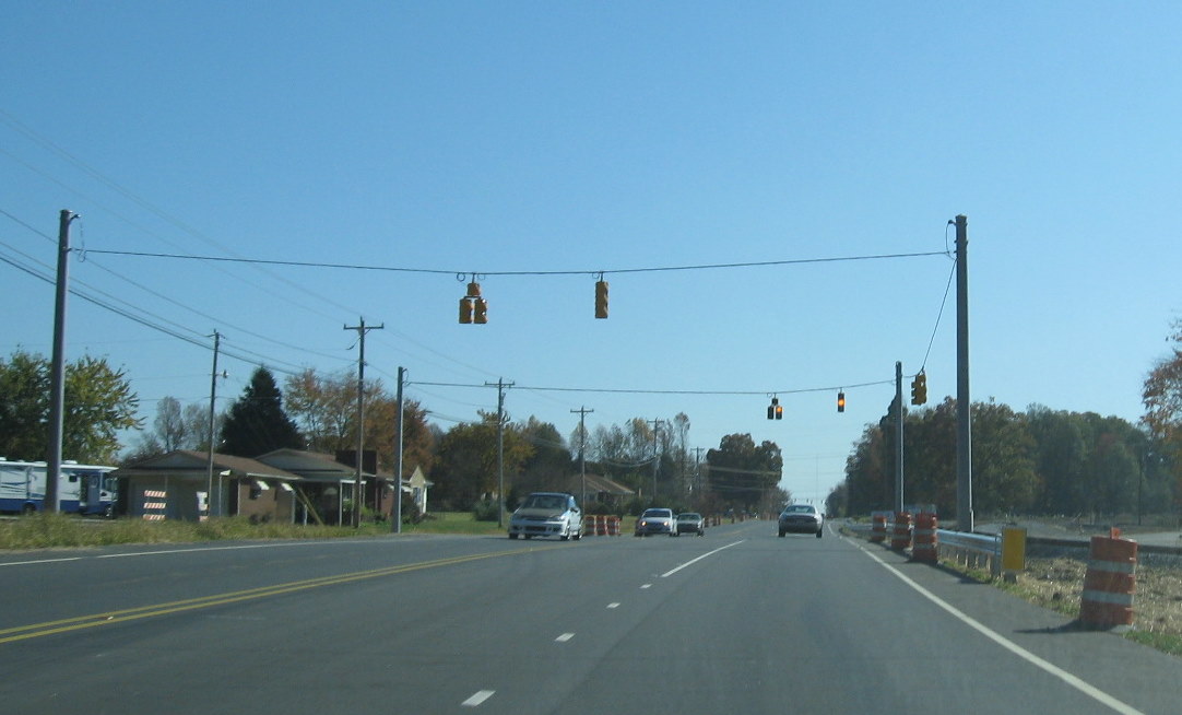 Photo of Cedar Square Road looking west from I-74 freeway toward existing 
US 311 showing progress in building new alignment in Nov. 2009